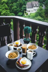 breakfast placed on table at terrace