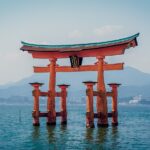 red shrine in body of water