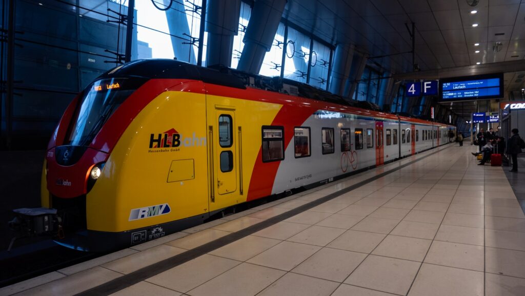yellow and red train in train station